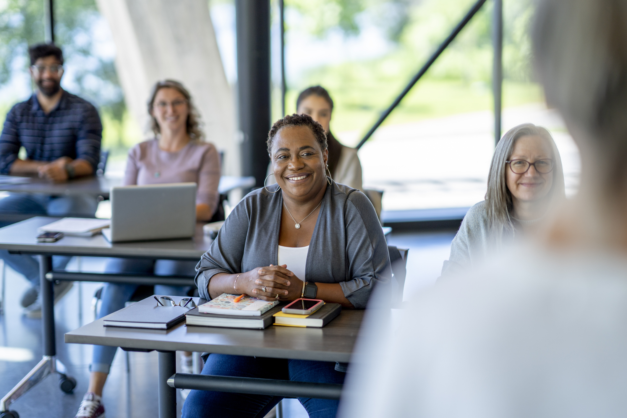 a class is being taught to a group of adults